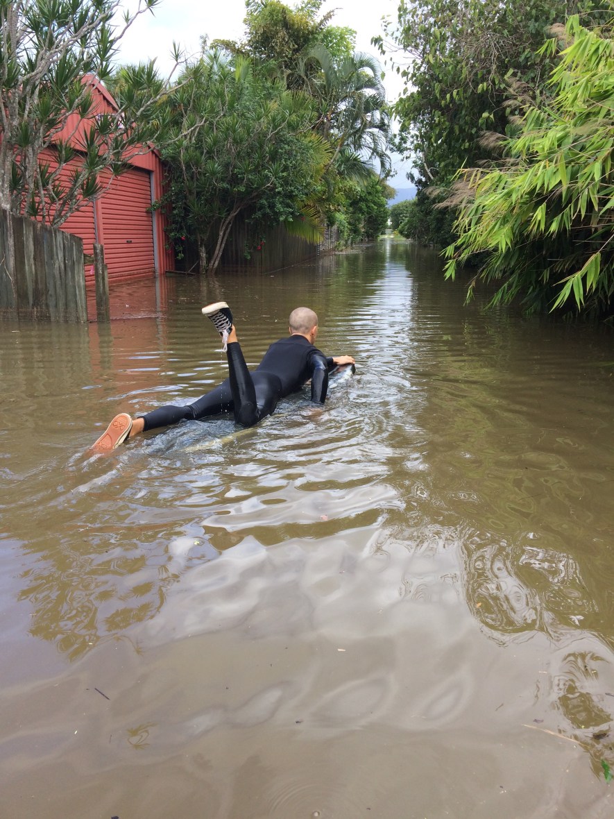 Surfing the floodwaters of a small flooded australian town