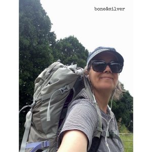 Walking up hills and mowing lawns in preparation for a hike, wearing a 50-litre backpack