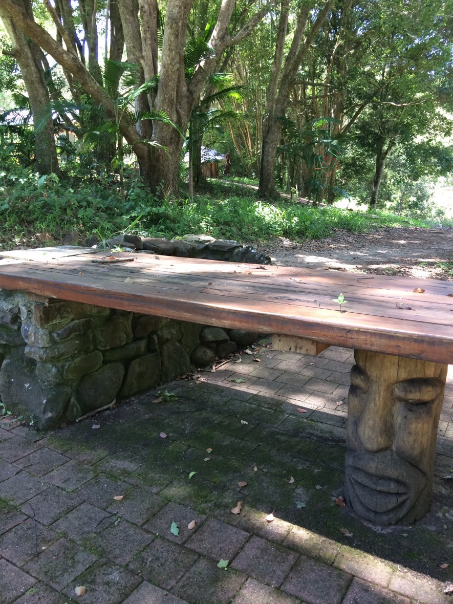 A hand-carved garden table on a retreat centre for Wellbeing