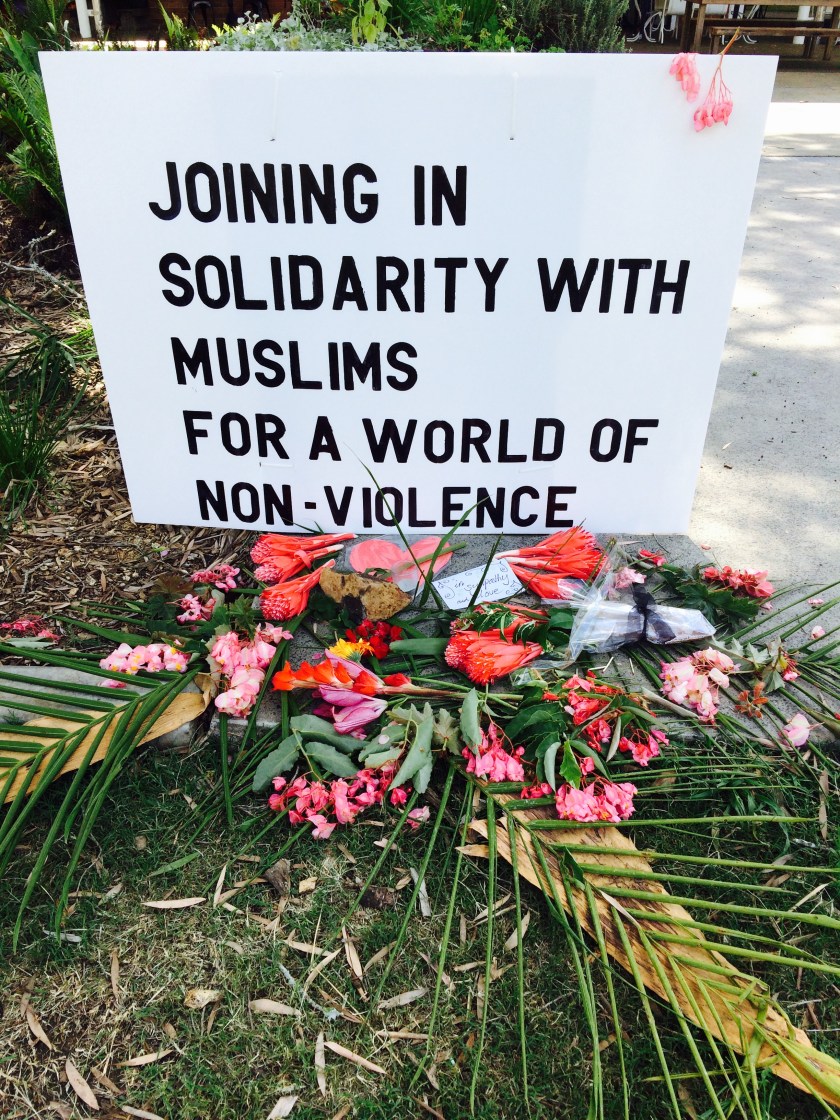 Leaving flowers on an altar for peace after the New Zealand shootings
